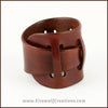 Handmade Leather Adjustable Claspless Slotted Wrist Cuff Bracelet, 2 inches wide, red brown and tan colors. By Erin Metcalf of Eirewolf Creations.