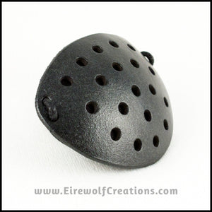 A handmade leather industrial style costume eye patch with 19 holes punched in it to allow some visibility, painted subtly sparkly black and backed with transparent black fabric. By Erin Metcalf of Eirewolf Creations.