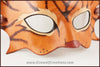 A handmade leather tabby cat mask for a masquerade costume, light brown with handpainted dark brown stripes and a dark pink nose and inner ears. By Erin Metcalf of Eirewolf Creations.