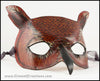 A Great Horned Owl handmade leather masquerade costume mask, dyed dark brown and carved and painted with feather details. By Erin Metcalf of Eirewolf Creations.