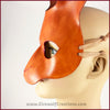 A handmade leather rabbit mask for a masquerade costume, dyed light brown with subtle red details painted around the eyes and nose. By Erin Metcalf of Eirewolf Creations.