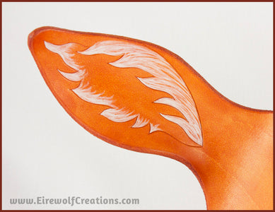 Detail of a handmade leather palomino unicorn mask for a masquerade costume, with a twisting horn and cream-colored forelock made of real deer hair. By Erin Metcalf of Eirewolf Creations.