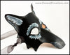 A grizzled Black Wolf mask for a masquerade costume, handmade from leather with carved and painted fur details. By Erin Metcalf of Eirewolf Creations.