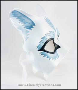 Silver Wolf half mask for a masquerade costume, handmade from leather and painted white with silvery fur details. By Erin Metcalf of Eirewolf Creations.