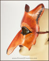 A handmade leather Wolf masquerade mask in rich tawny brown colors, with carved and painted fur details. By Erin Metcalf of Eirewolf Creations.